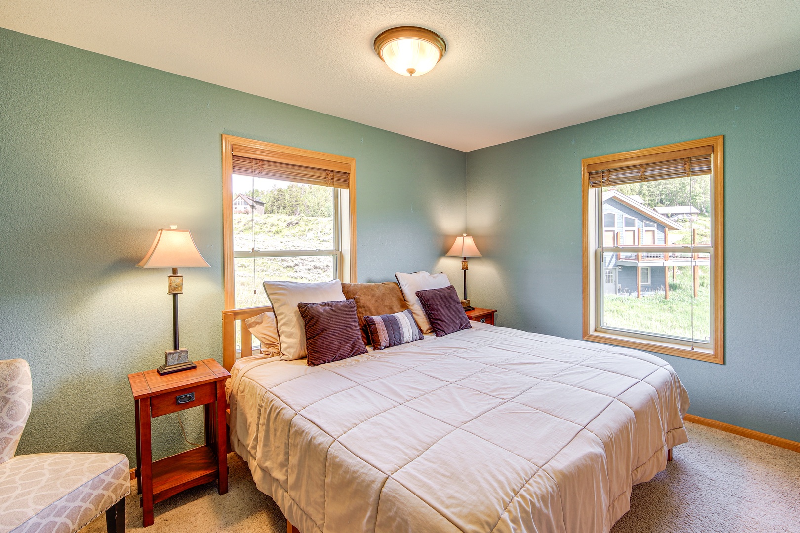 Unwind in your peaceful bedroom with soft linens and mountain views through dual windows.