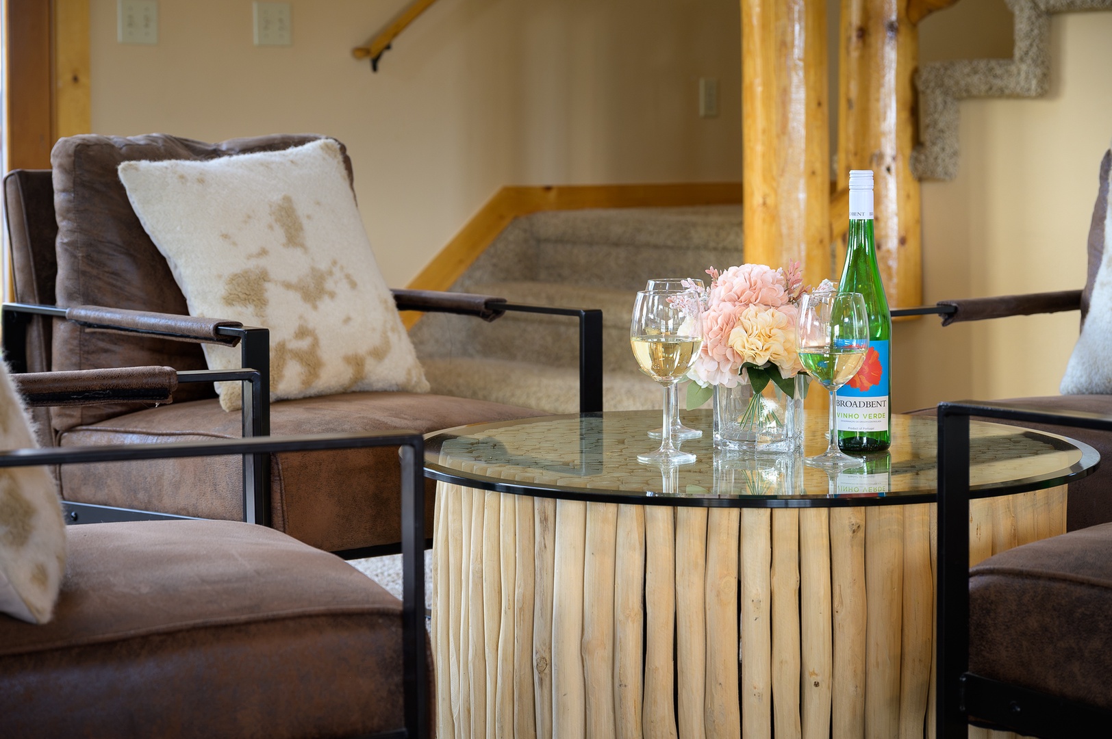 Picture yourself settling into this cozy sitting area with a glass of wine and your favorite company. The rustic charm of natural wood and stone creates a warm, inviting atmosphere perfect for unwinding after your adventures.