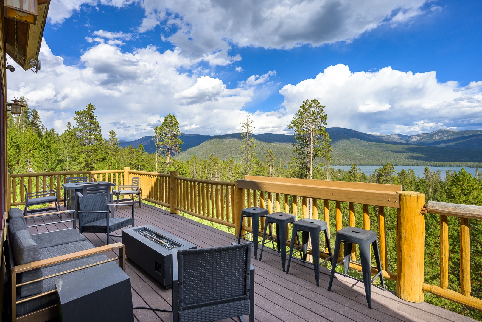 Breathtaking mountain and lake panorama awaits from your private deck, where you can sip morning coffee at the bar-height seating or unwind by the fire table as the sun sets over the peaks.