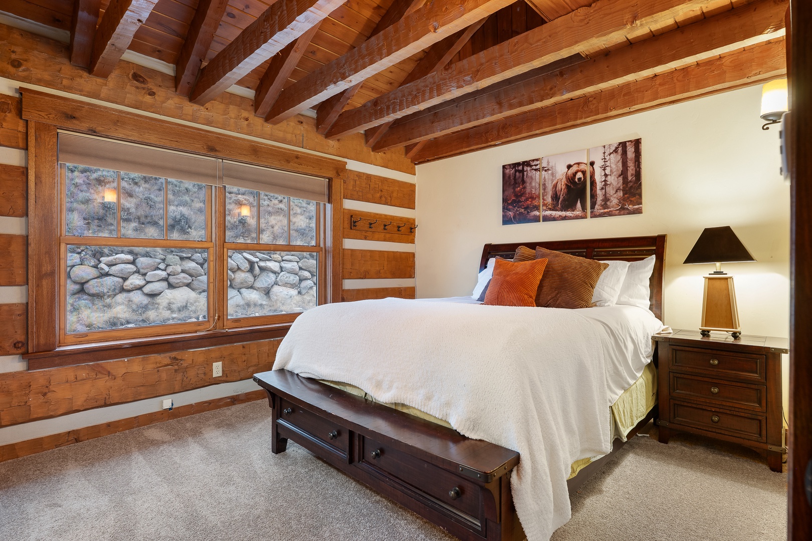 Drift off in your rustic log cabin queen bedroom, and peaceful mountain views.