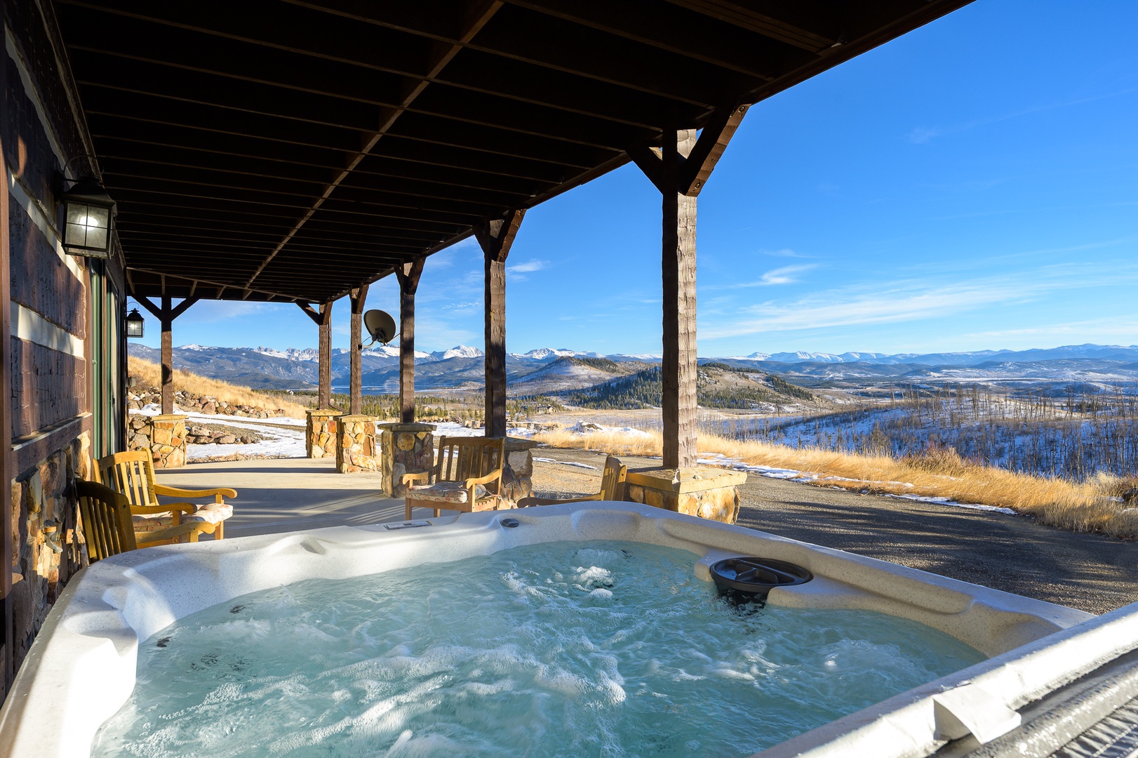 Soak in your private hot tub while gazing at breathtaking mountain vistas stretching endlessly before you.