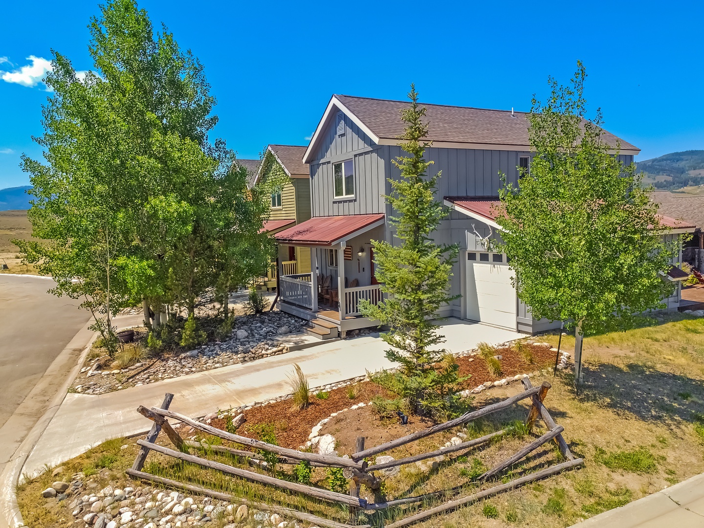 This charming property sits in a peaceful mountain neighborhood, surrounded by natural landscaping and open skies, offering an inviting escape from everyday life.