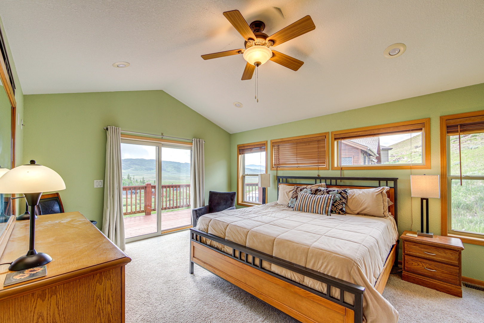 Wake up in your spacious bedroom with mountain views and private balcony access. Natural light fills your restful retreat.