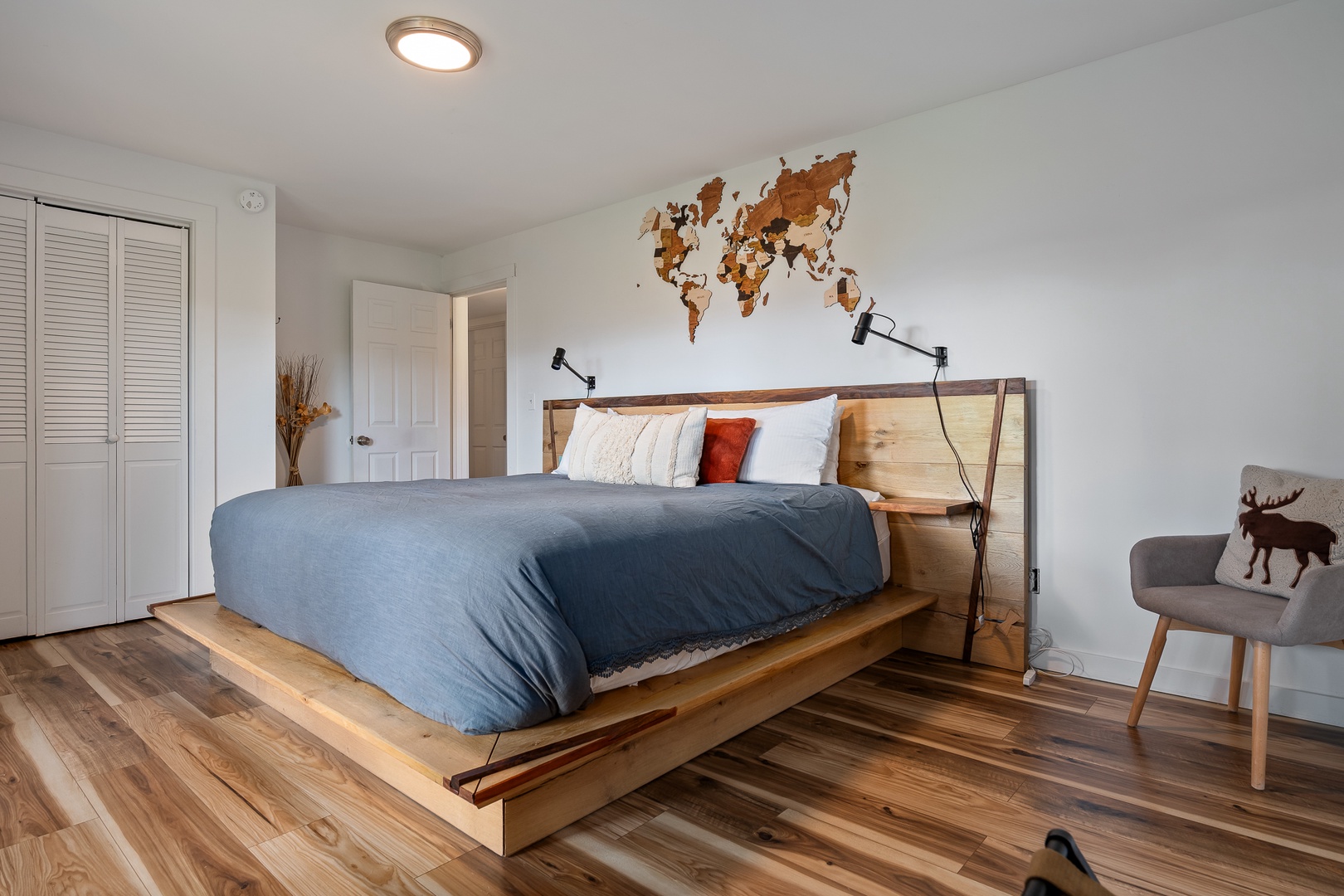 Drift off to sleep in your spacious bedroom with a beautifully crafted platform bed and warm wood floors that invite barefoot comfort. The minimalist design and natural wood tones create a peaceful sanctuary for restful nights.