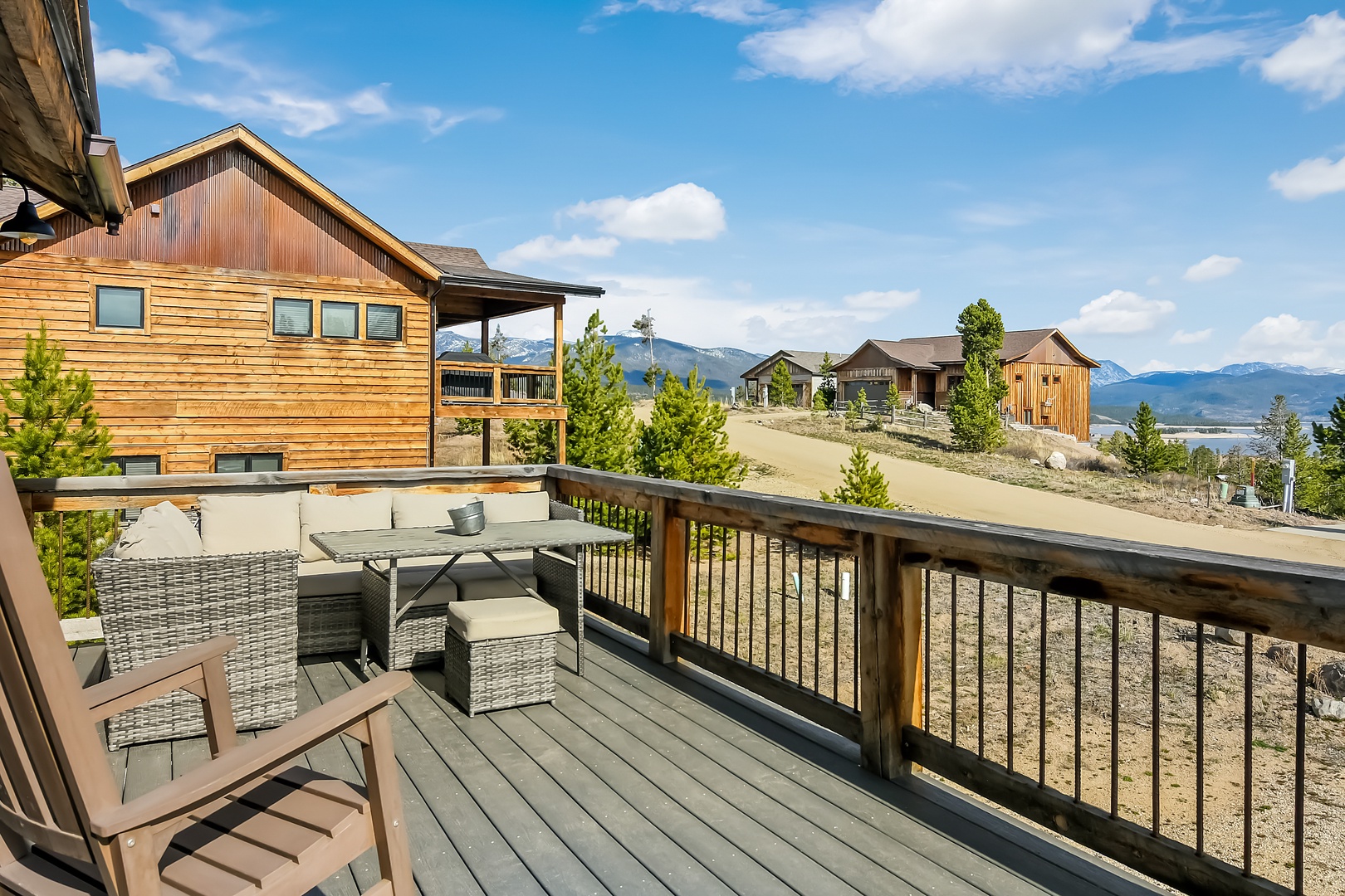 Relax on your private deck with mountain views, outdoor dining, and comfortable seating for peaceful mornings and sunset evenings.
