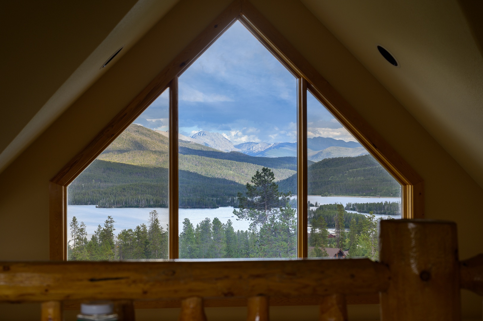 Wake up to stunning mountain and lake views framed perfectly through your loft window—breathtaking scenery that welcomes you to every new day.