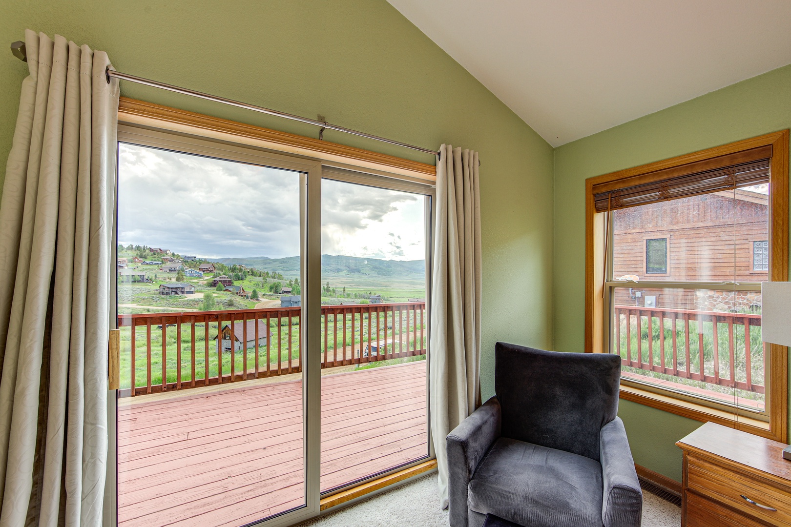 Relax in your cozy reading chair while enjoying sweeping mountain views through the large windows and direct access to your private deck.