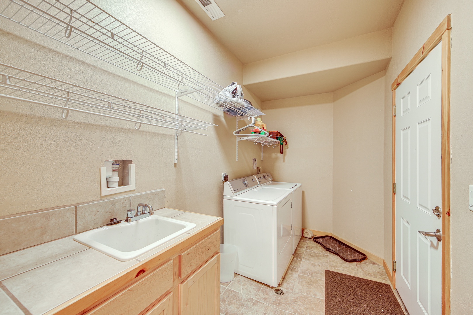 Your dedicated laundry room makes extended stays effortless, with a sink for hand-washing delicates and ample storage for all your belongings.