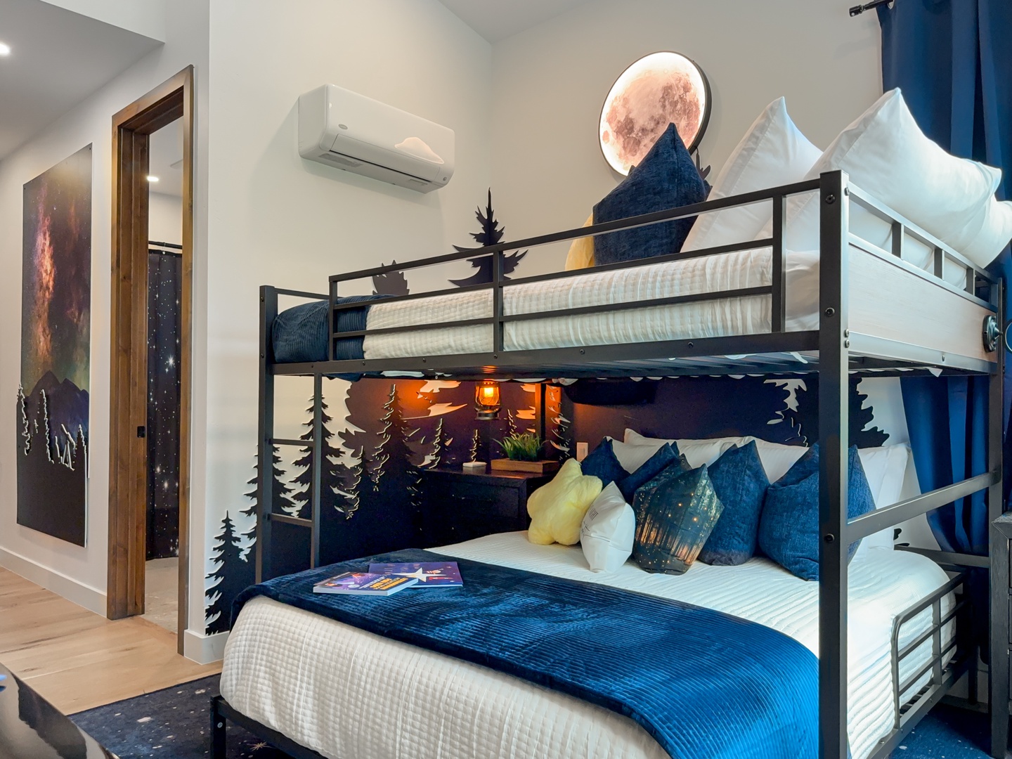 Settle in for adventure in this cozy bunk-style bedroom. Your space features cool mountain-inspired décor, soft bedding on both bunks, and air conditioning for your comfort.