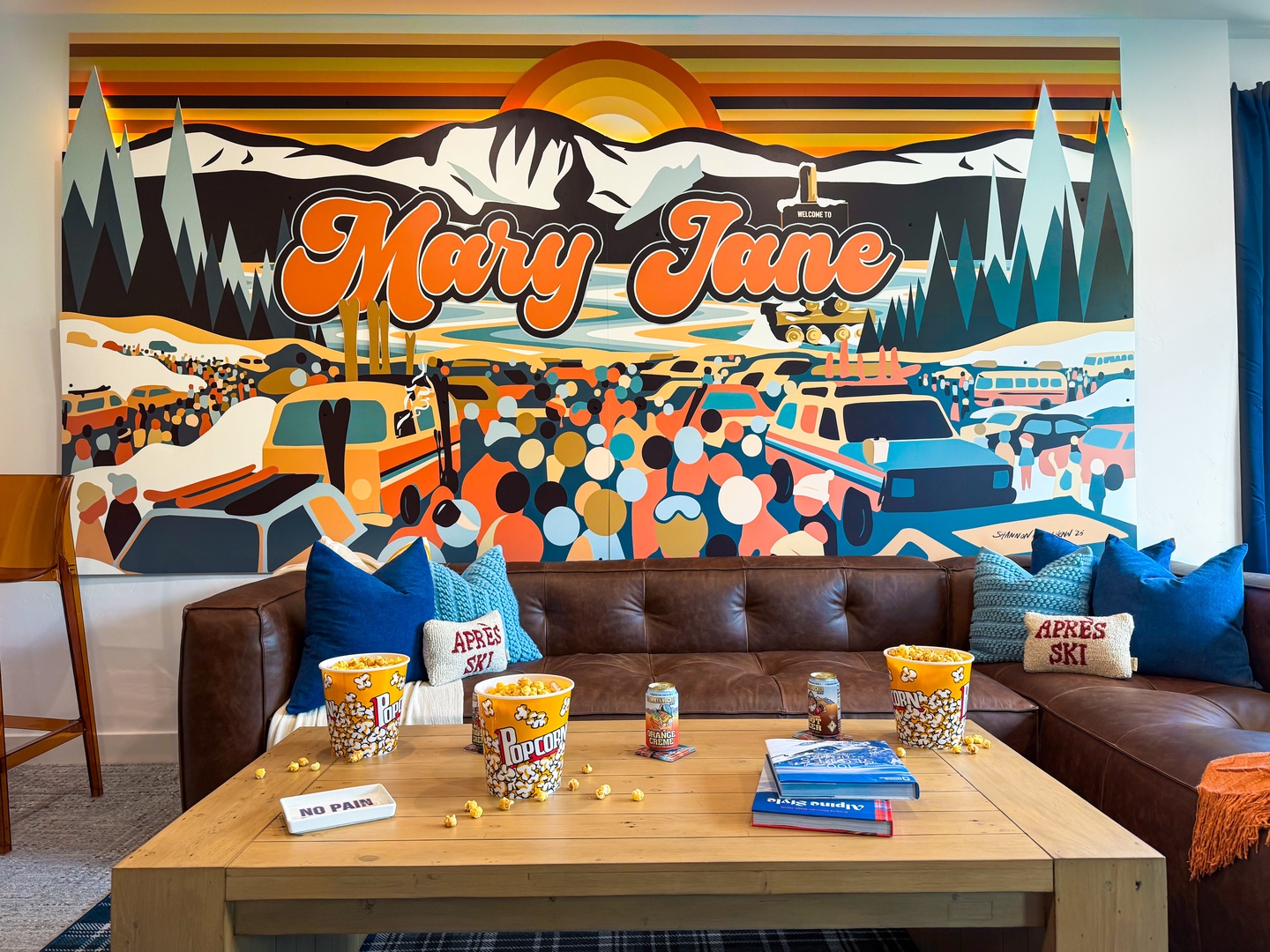 Sink into plush leather sofas and settle in for a cozy evening with popcorn, cold drinks, and mountain vibes all around you.