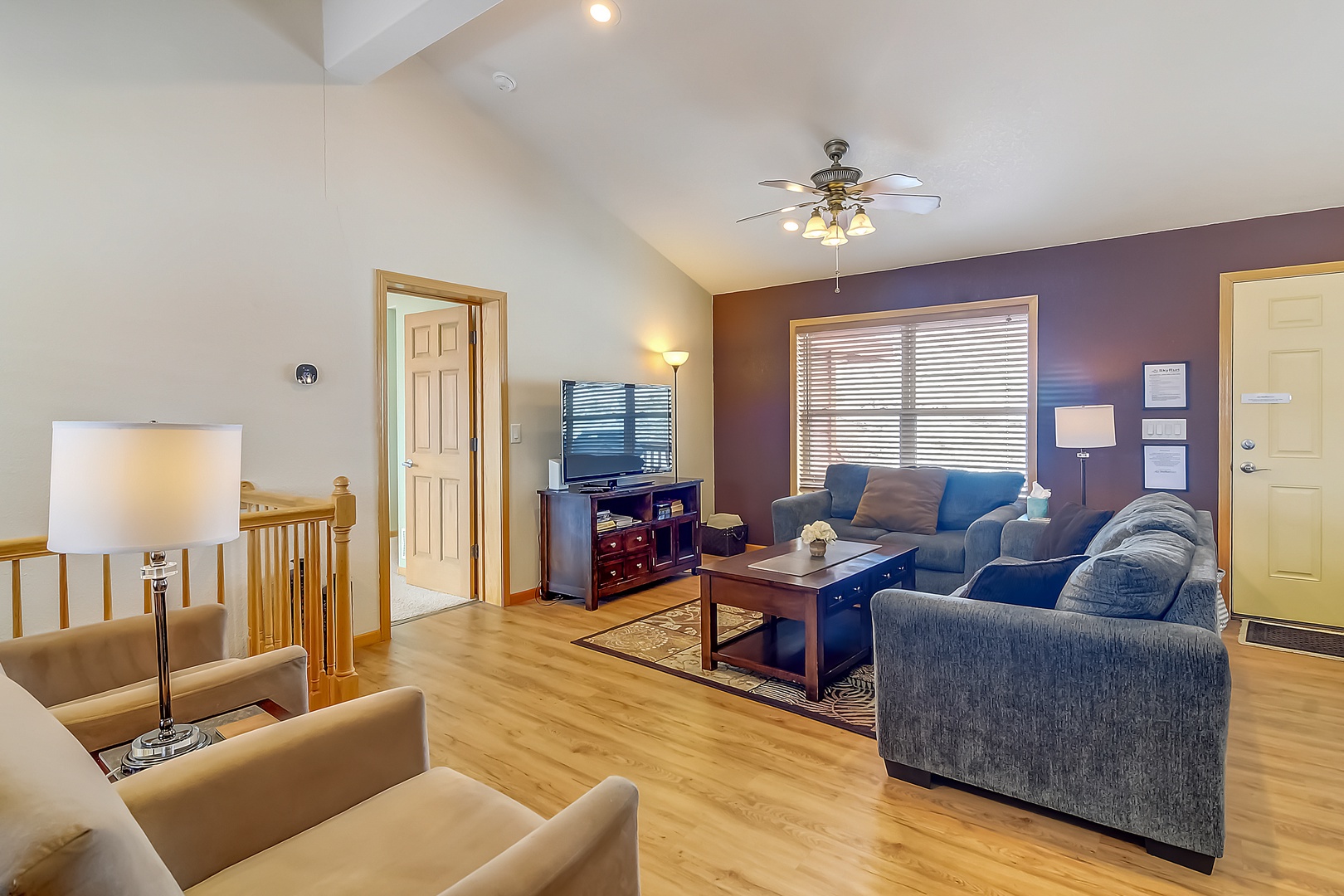 Sink into comfortable sectional seating while warm light fills your spacious living room, perfect for relaxing evenings with loved ones.