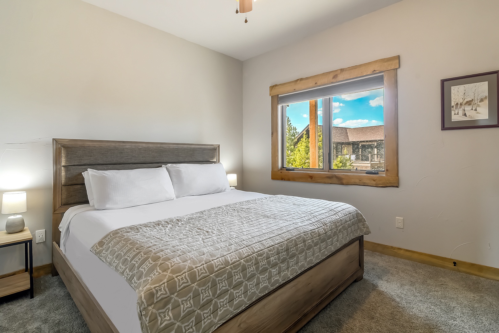 Drift off to sleep in this cozy bedroom, where crisp linens and soft lighting create your perfect mountain retreat sanctuary.