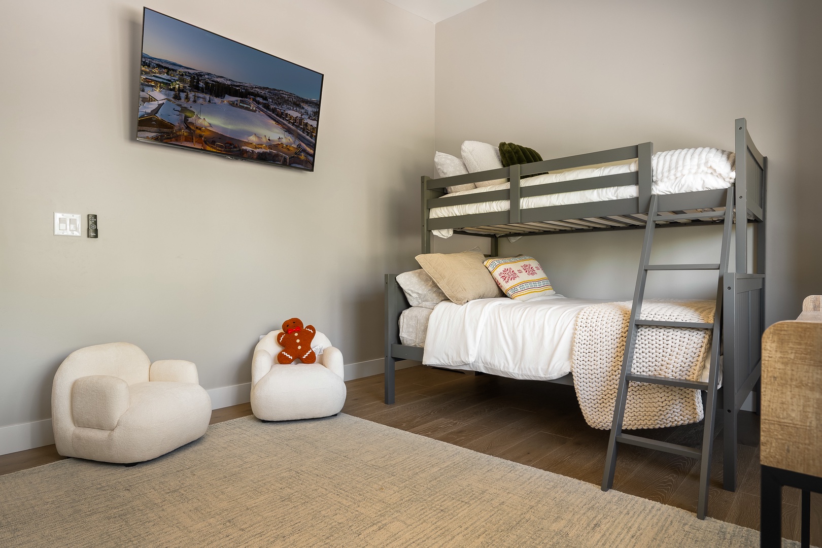 Bedroom #3 is a cozy kids' room awaits with comfy bunk beds and a plush reading chair.