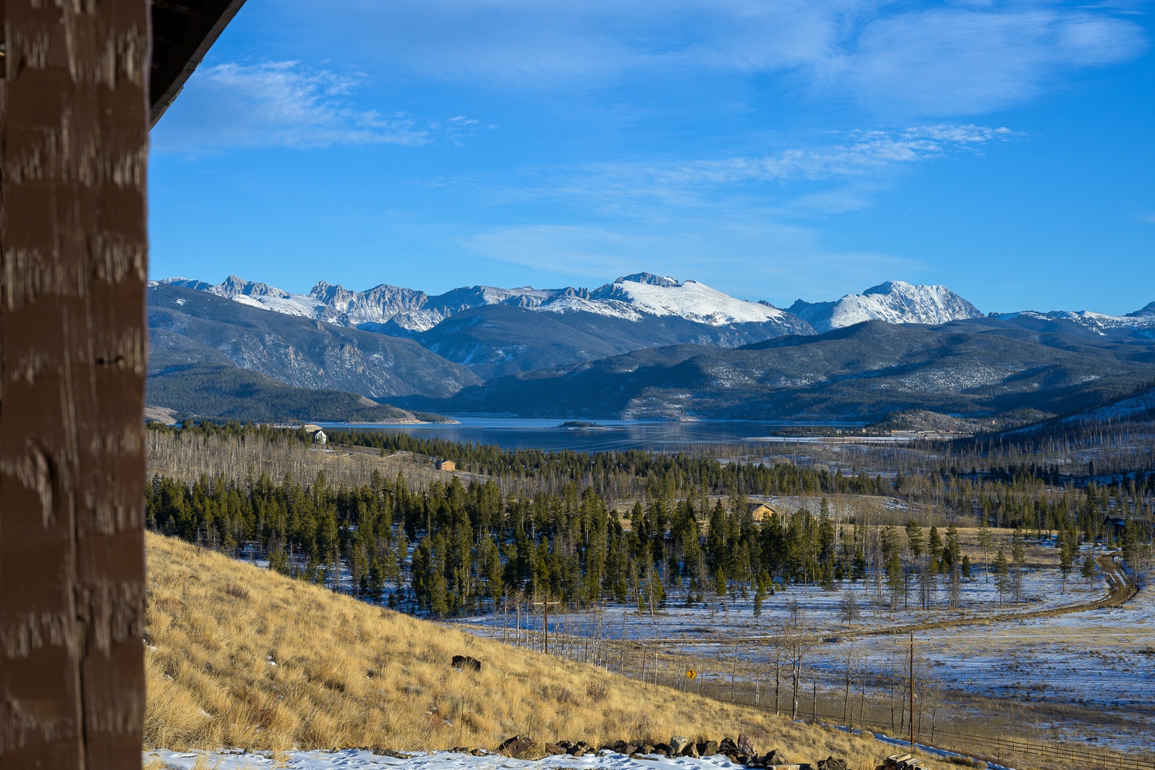 Stunning mountain vistas and pristine lake views create a breathtaking winter landscape from this elevated property location.