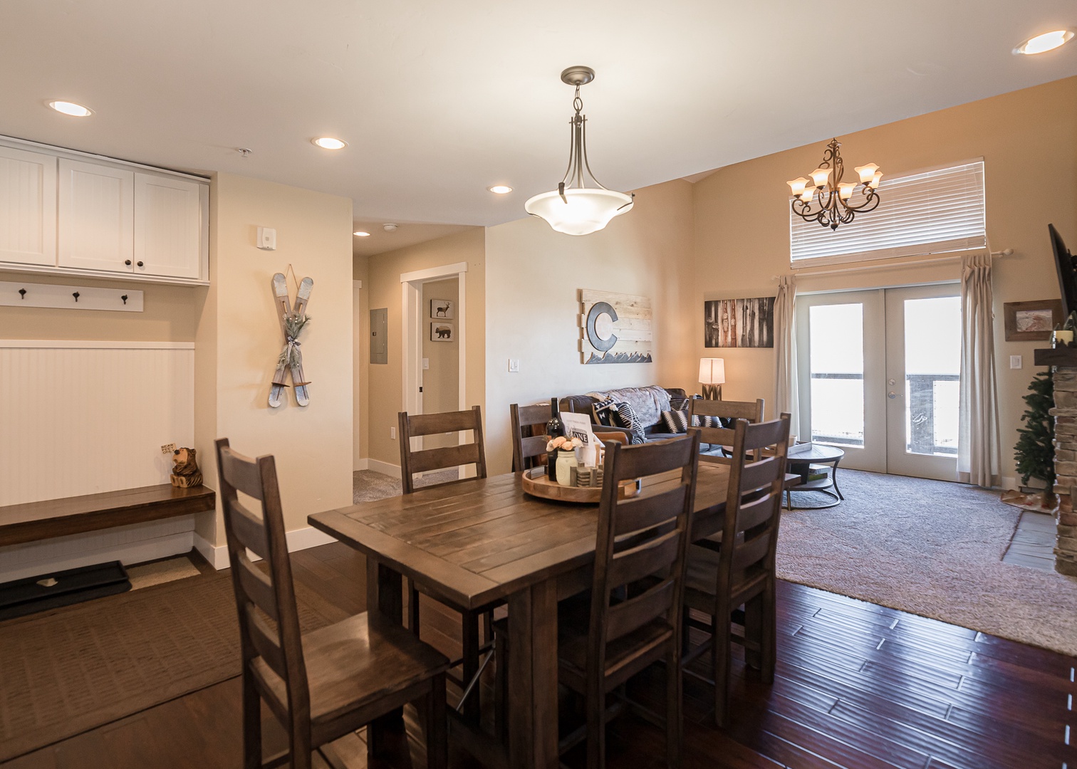 Gather around your spacious dining table for memorable meals, with warm wood tones and mountain views creating the perfect backdrop for relaxation.