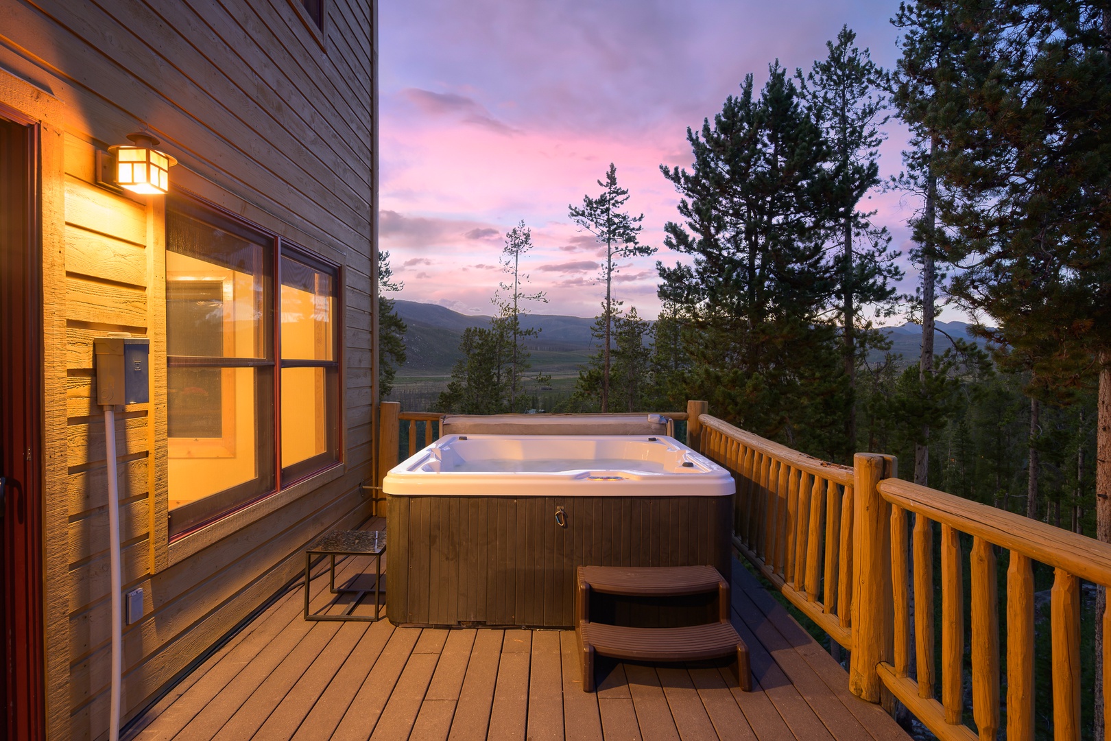 Step onto your private deck and soak in the hot tub as the sun sets over the mountains, surrounded by towering pines and endless views of the valley below.