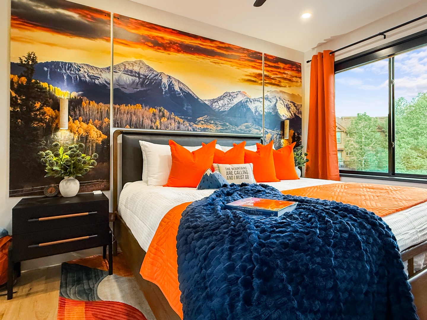 Sink into crisp white linens and bold pops of color as natural light streams through your windows. Wake up refreshed in this thoughtfully styled bedroom, ready for your next mountain adventure.