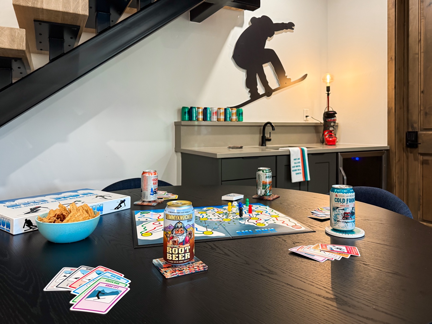 Gather around for game night with drinks and snacks—your table is already set for laughter and friendly competition. It's your perfect après-ski hangout spot.
