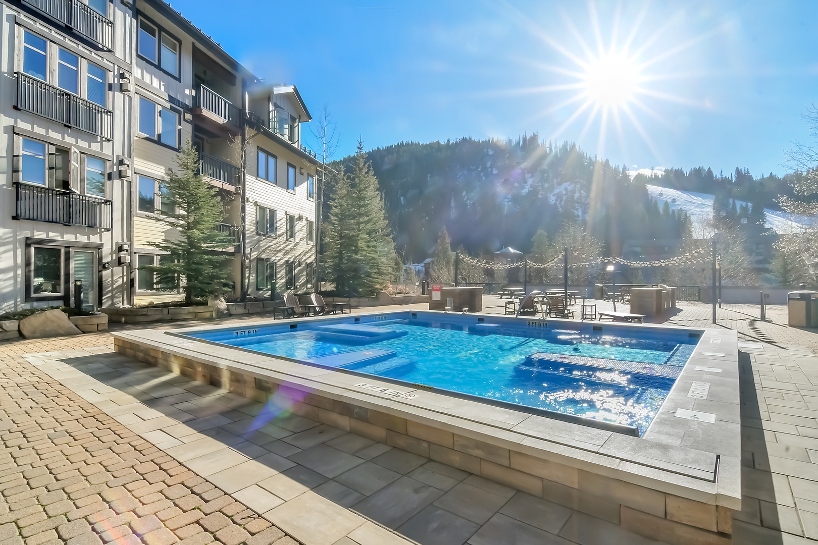 Large Year round Shared Hot Tub with Mountain Views just steps from your condo!