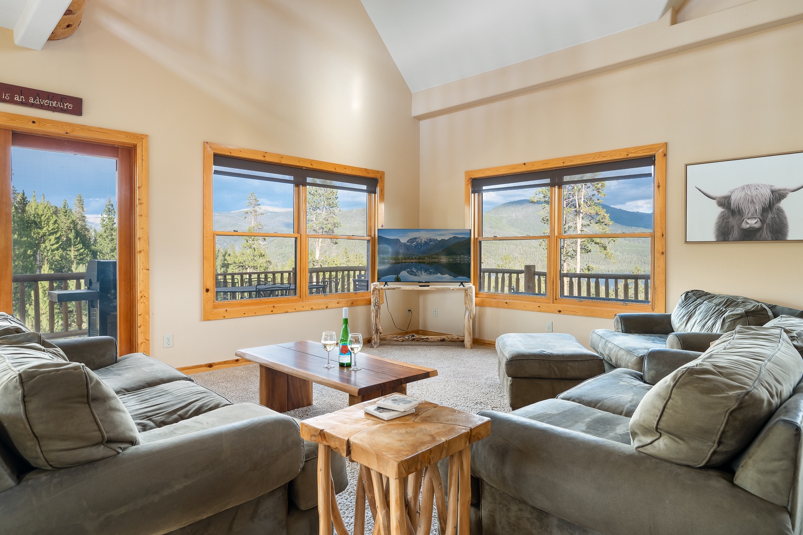 Sink into plush seating and soak in breathtaking mountain vistas through expansive windows. Your alpine escape features rustic wood accents, vaulted ceilings, and direct balcony access to the fresh mountain air.