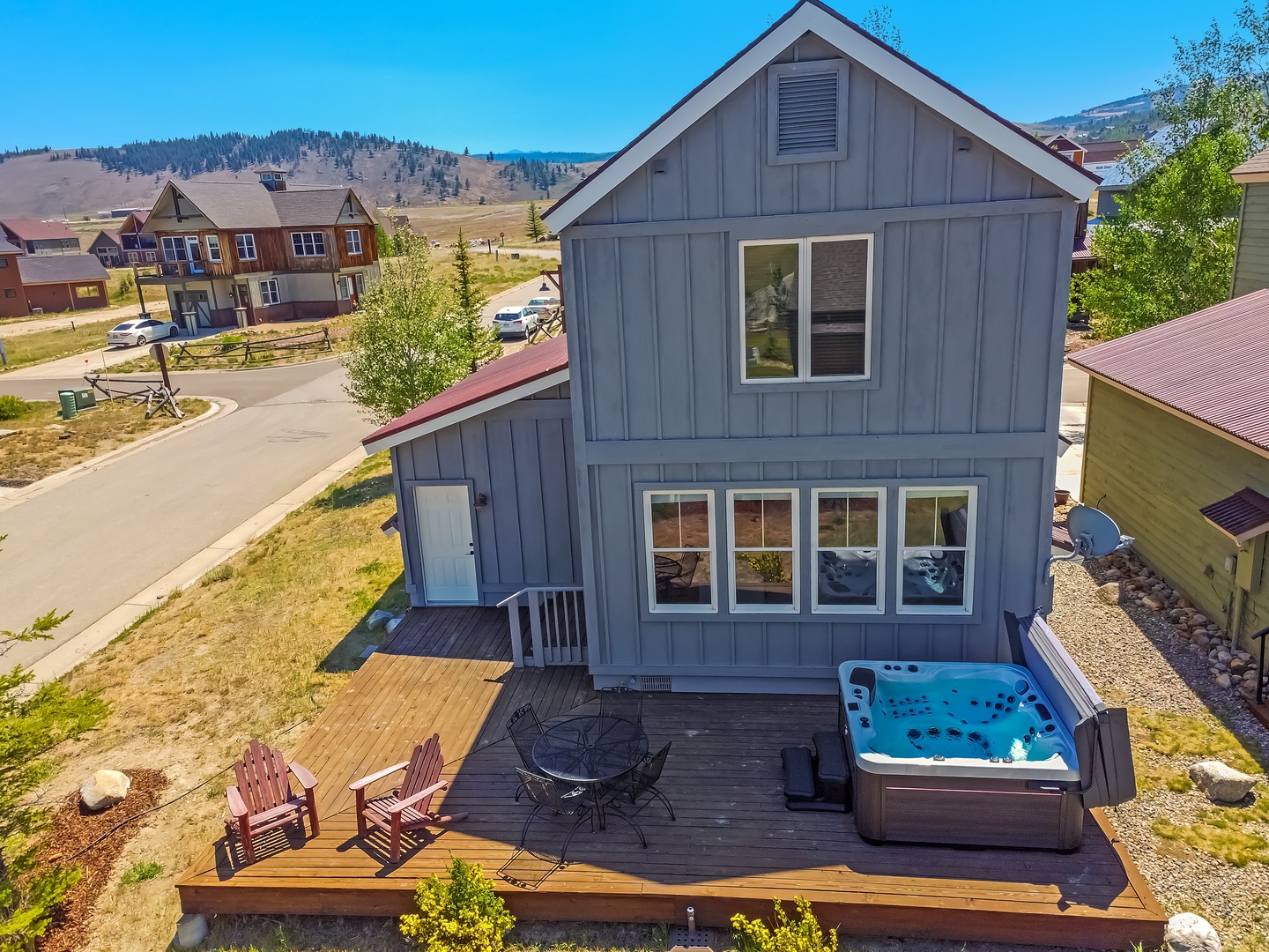 A charming mountain retreat awaits, complete with a private hot tub on your spacious deck where you can soak under open skies surrounded by stunning alpine views.