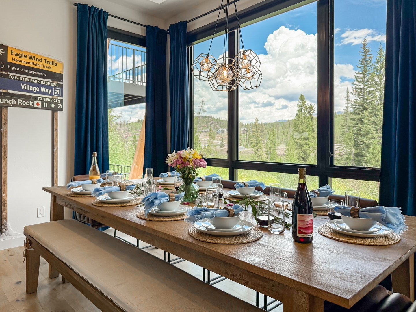 Gather around this inviting dining table for memorable meals with mountain views framing your retreat. The space offers natural light and easy access to nearby trails for your alpine adventures.