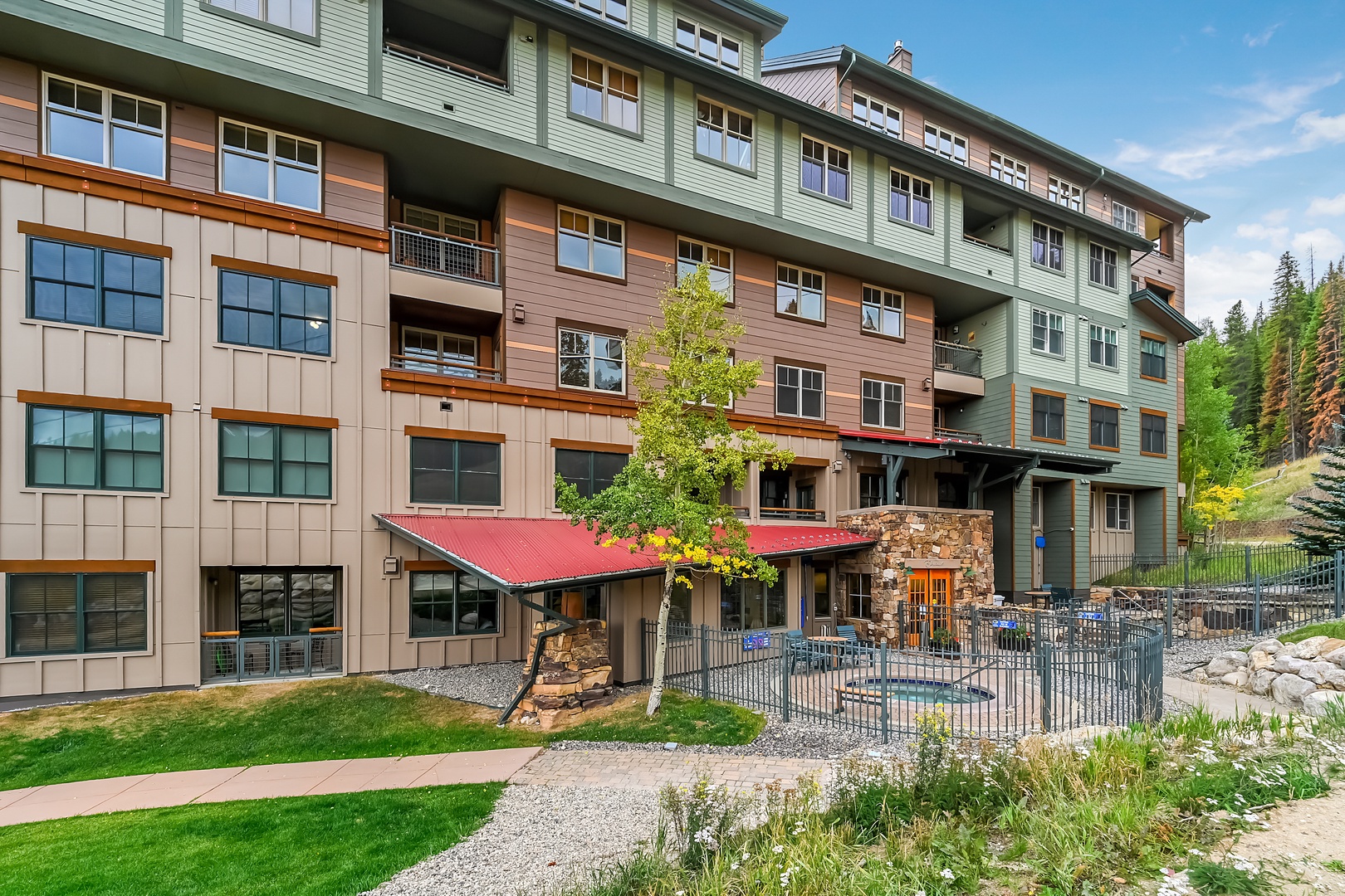 The property stands nestled against a ski run under the Gondola, with modern mountain architecture that blends earth-and nature.ndant windows. A cozy community hot tub is ready to soothe your muscles after a long day of activity