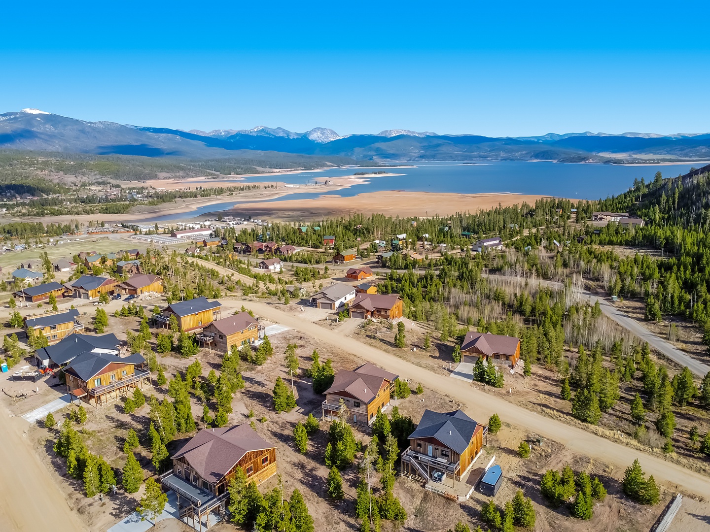 Aerial view of this home with views of the Rocky Mountains and Grand Lake .