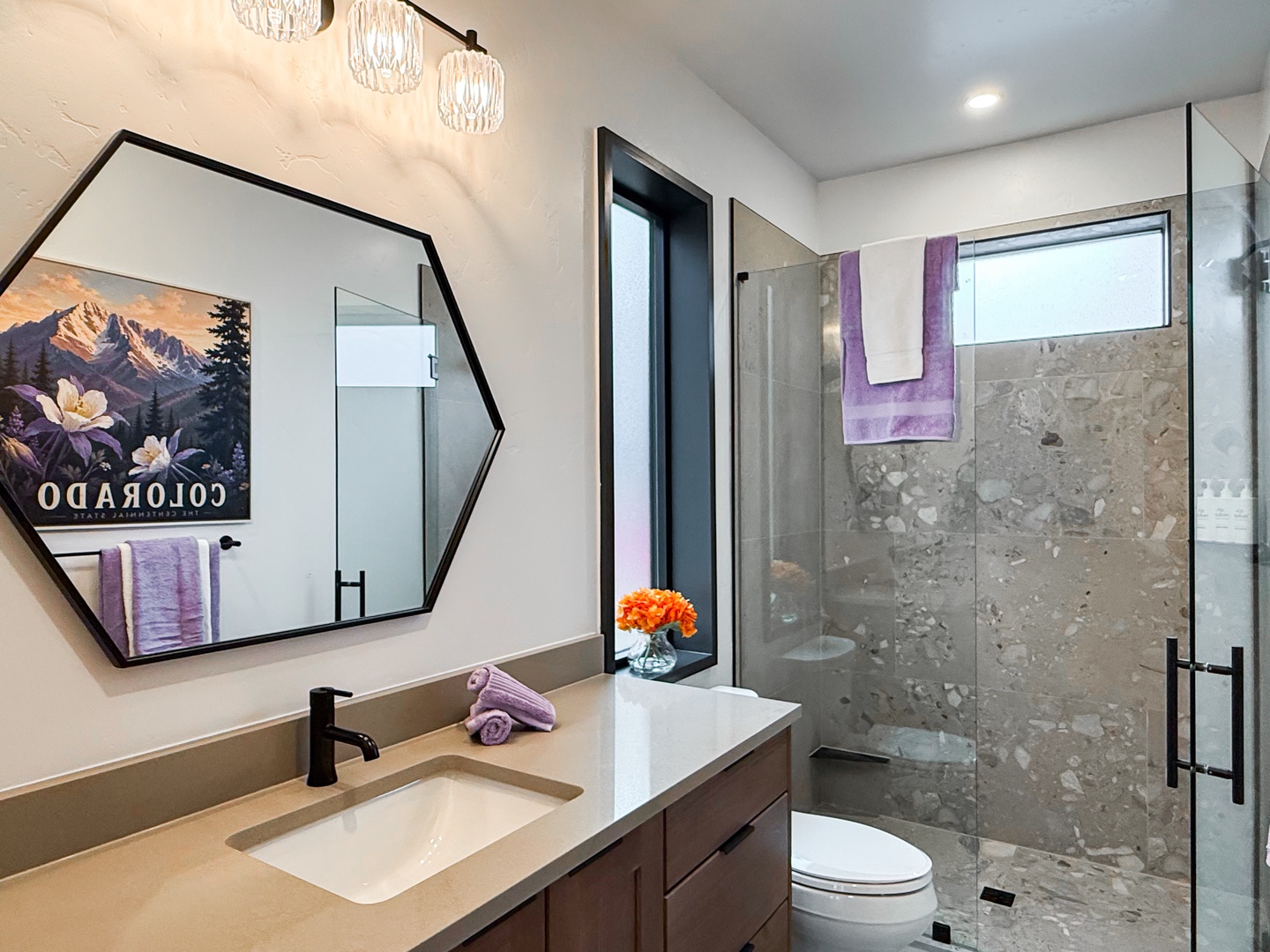 The full bathroom has a single vanity and a walk-in shower.