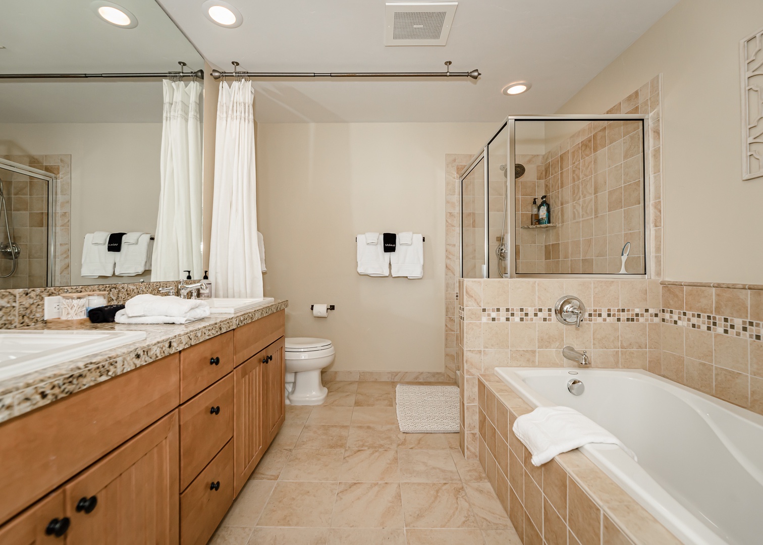Unwind in your spacious master bathroom with granite counters, soaking tub, and separate glass shower.