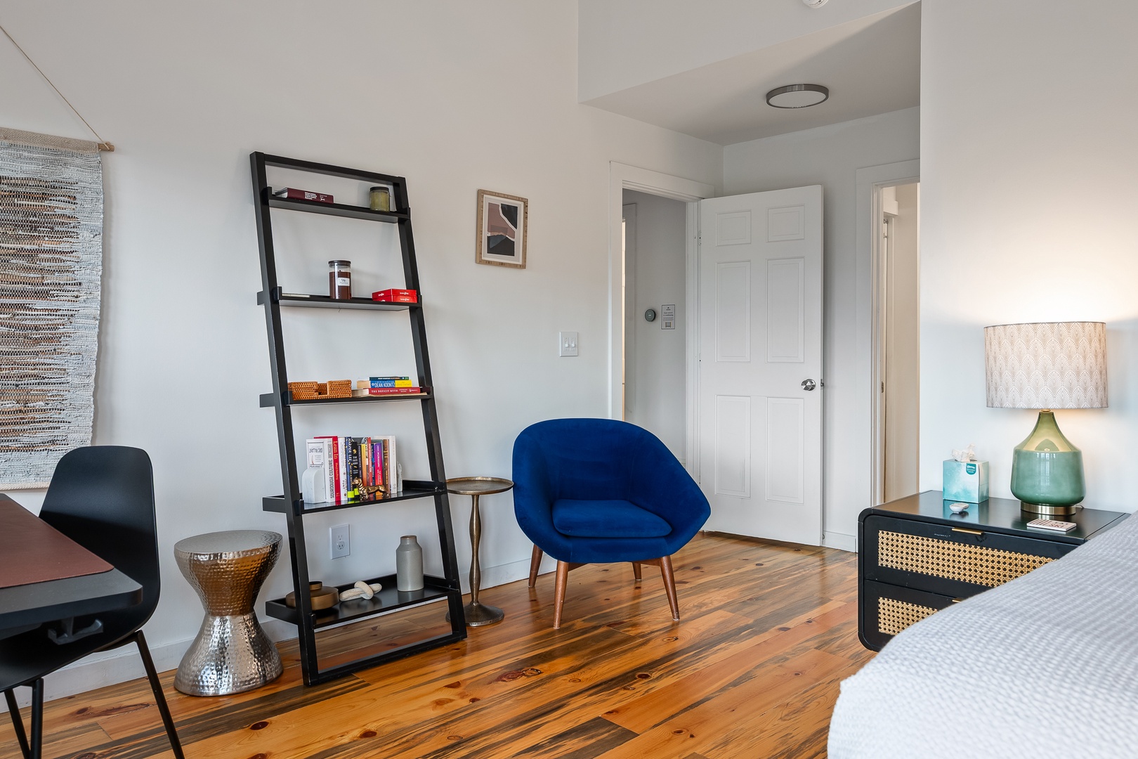 Your bedroom retreat features warm wood floors, cozy seating, and thoughtful touches that invite you to relax and unwind in style.