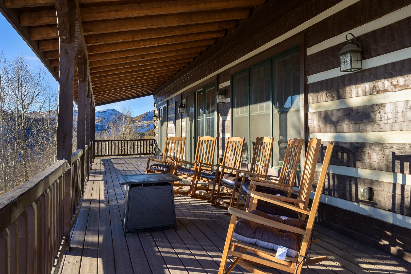 Settle into your rocking chair on this expansive wrap-around porch, where mountain vistas and gentle breezes create the perfect afternoon retreat.