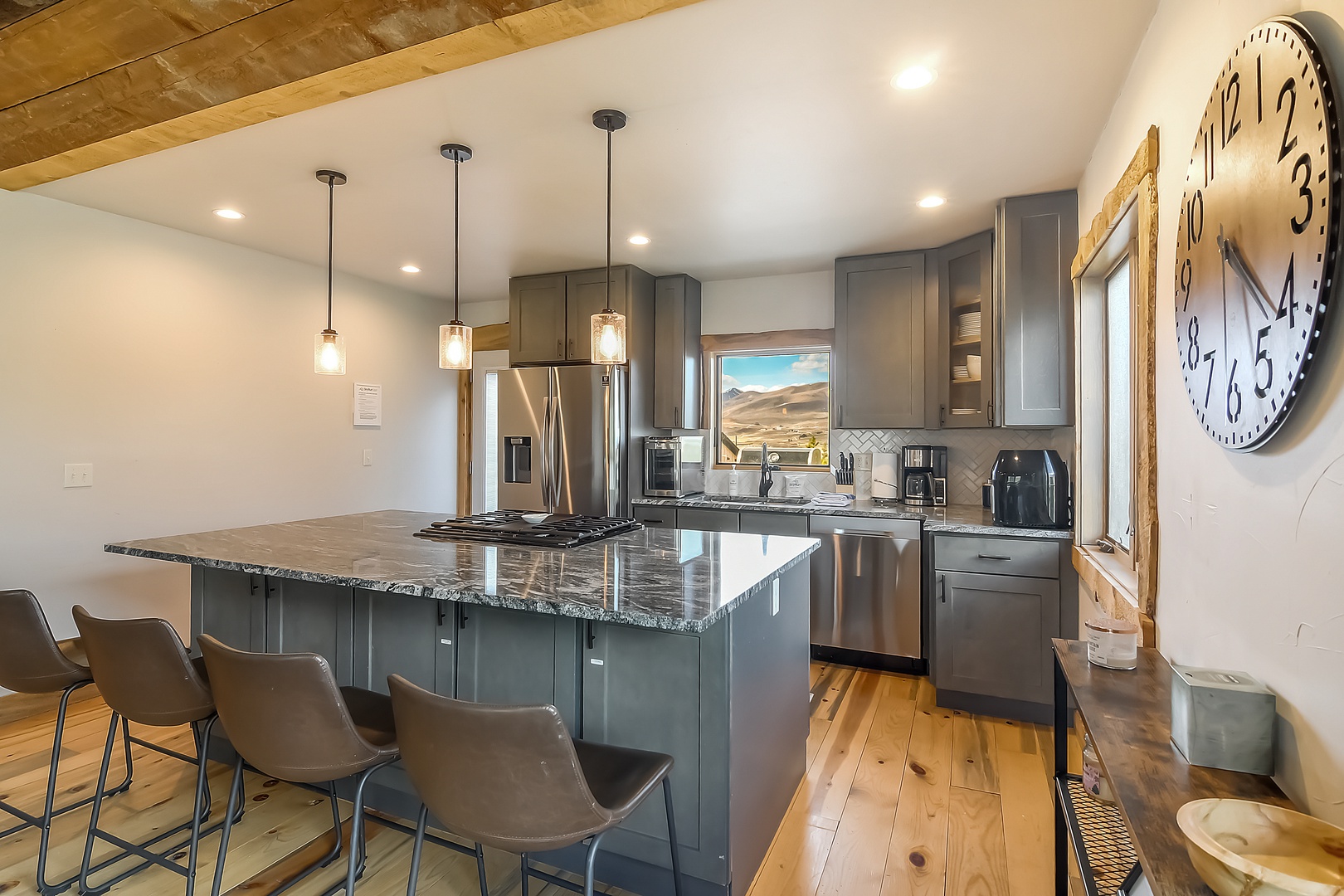 Your gourmet kitchen awaits with granite countertops, stainless steel appliances, and a spacious island perfect for morning coffee or evening meals.