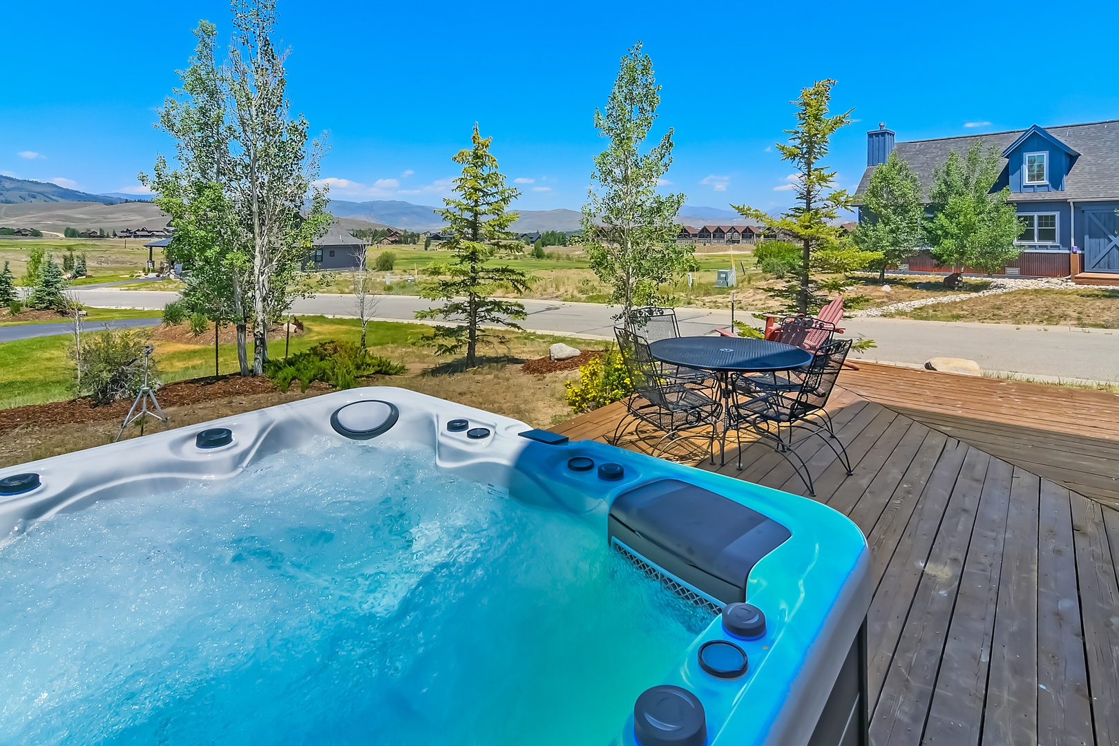 Relax in your Private Hot Tub with panoramic mountain views on Grand Elk Golf Course.