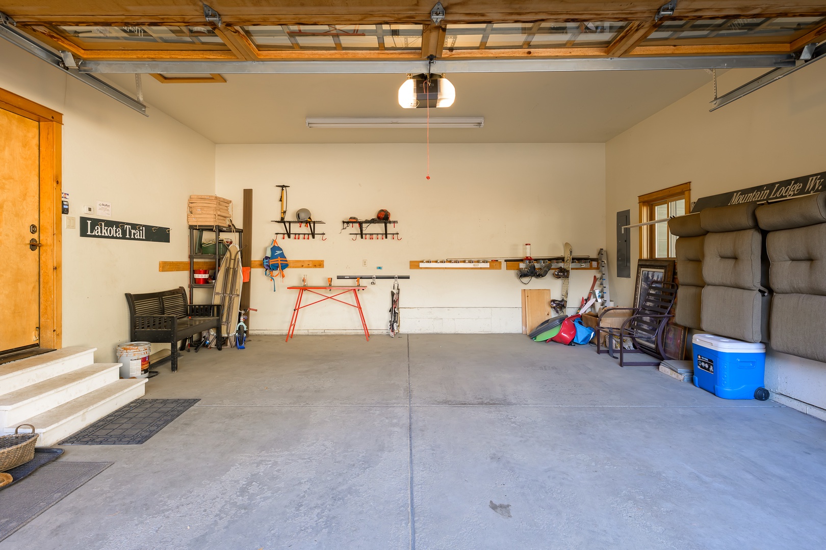 Spacious garage with organized storage, tools, and equipment - perfect for your outdoor gear and projects during your stay.