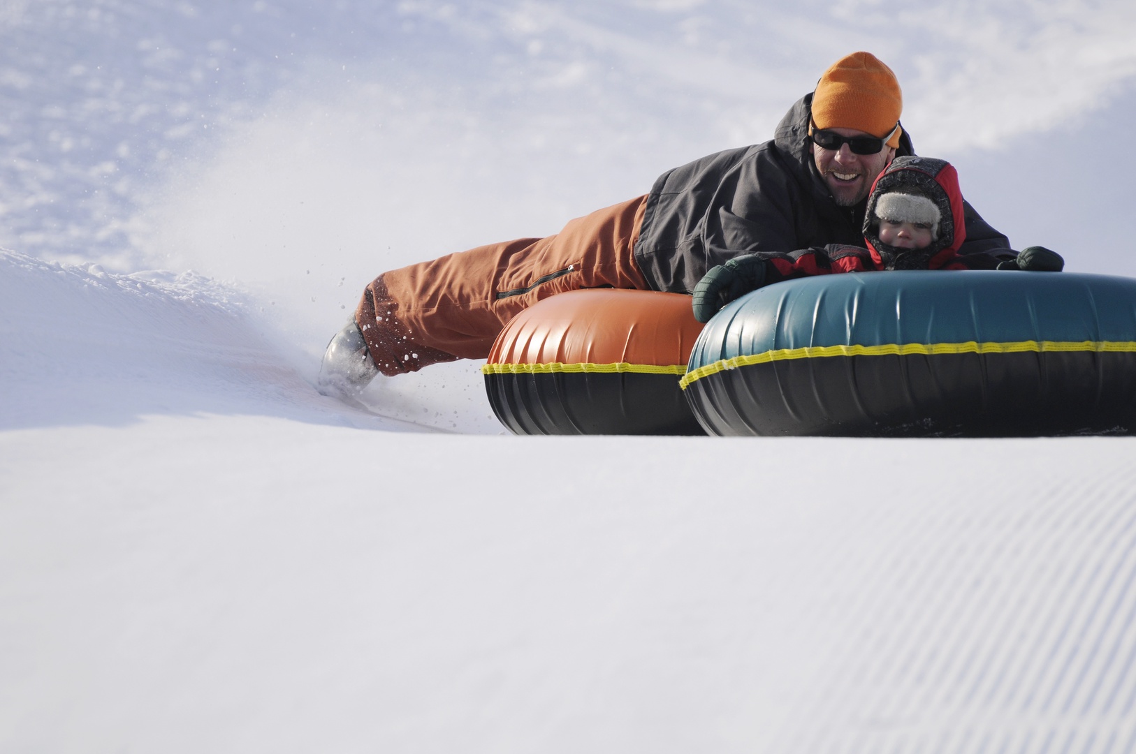 Adventure awaits with thrilling snow tubing experiences just minutes from your winter retreat.