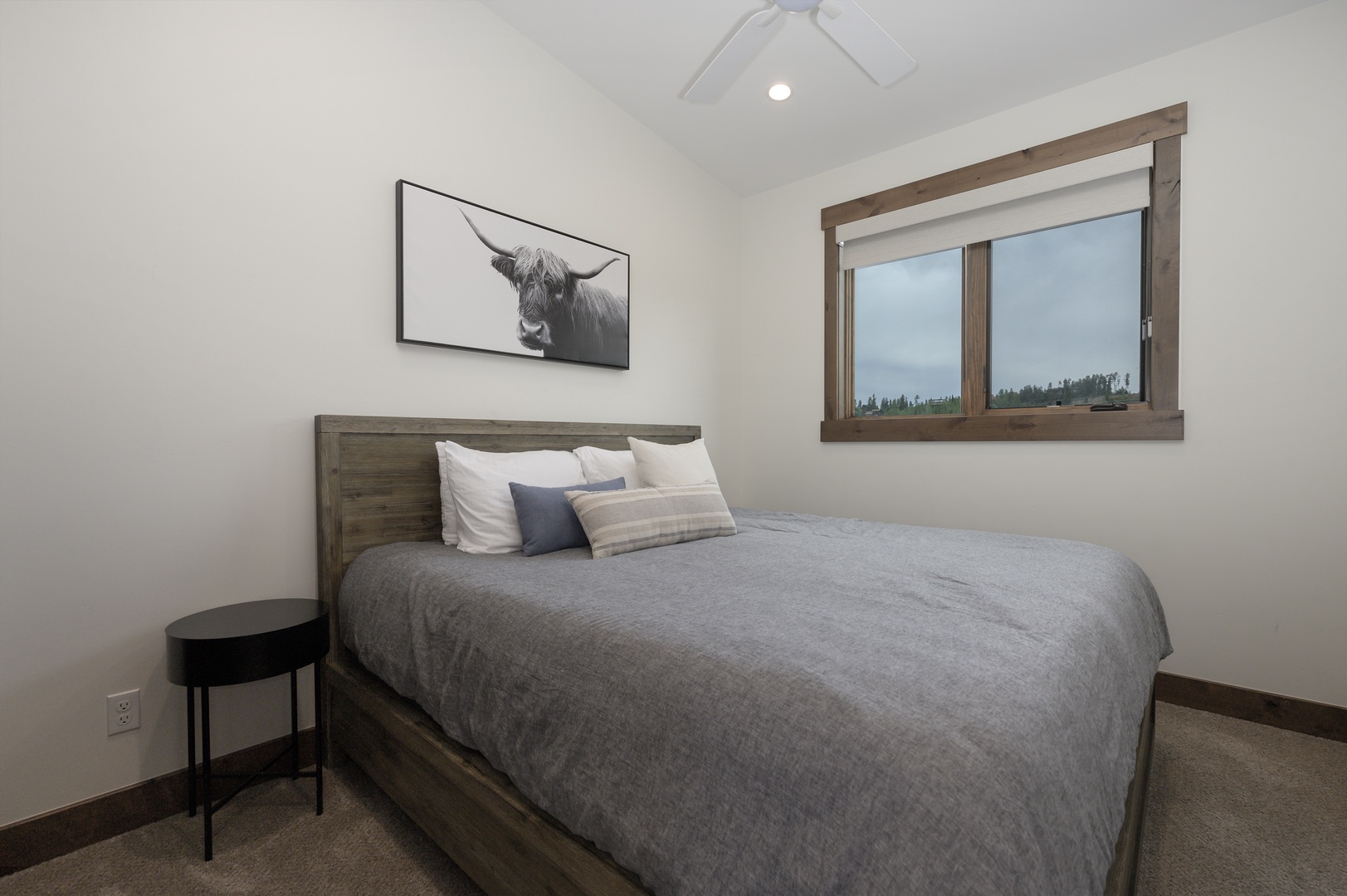 Drift off in your cozy bedroom with rustic wood details, soft linens