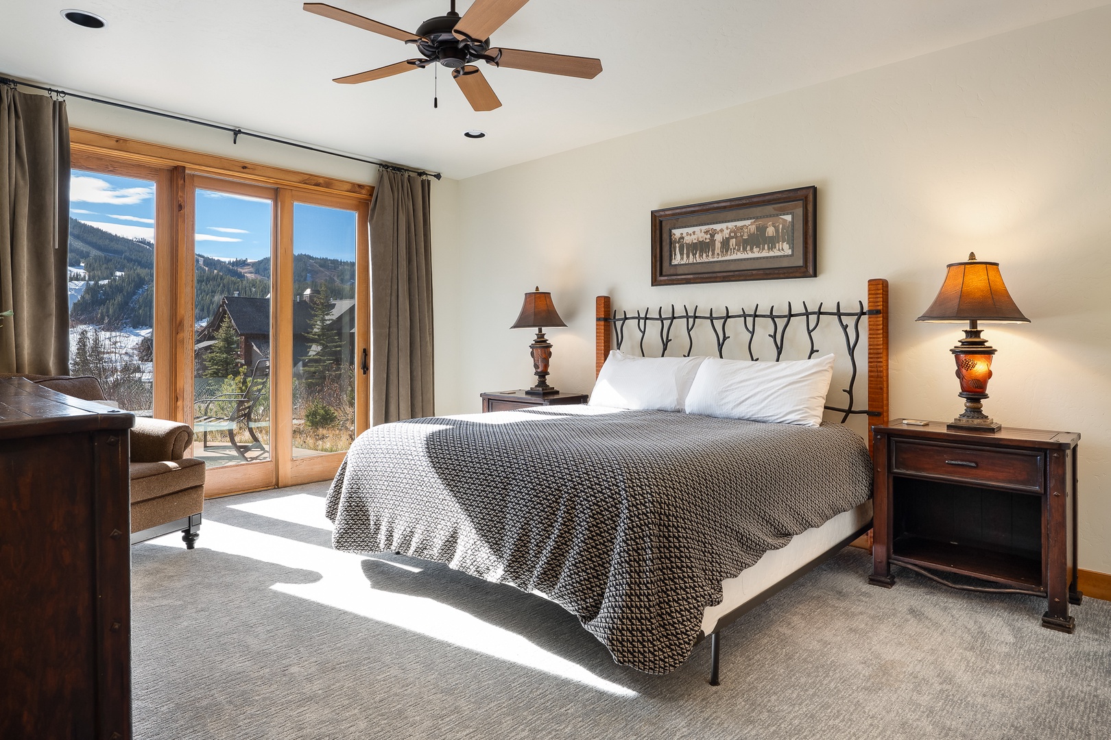 Wake up to breathtaking mountain views from your cozy bedroom in this king bedroom downstairs