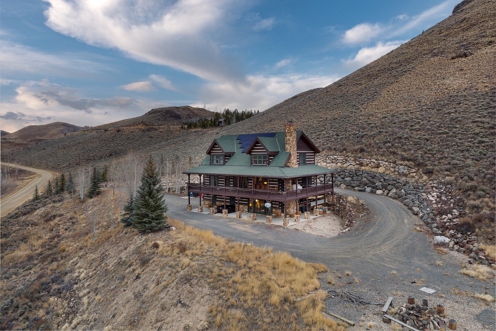 Nestled in mountain wilderness with multi-level decks and private access road.