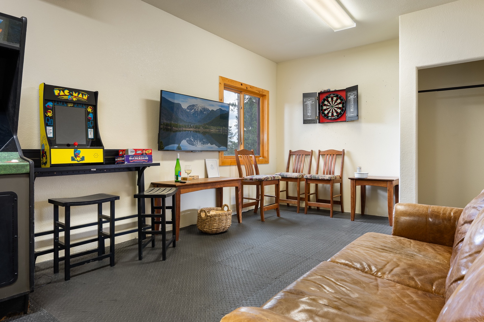 Challenge your friends to arcade games and darts in this fun-filled game room. Kick back on the leather couch or grab a seat at the tables—your perfect downtime retreat awaits.