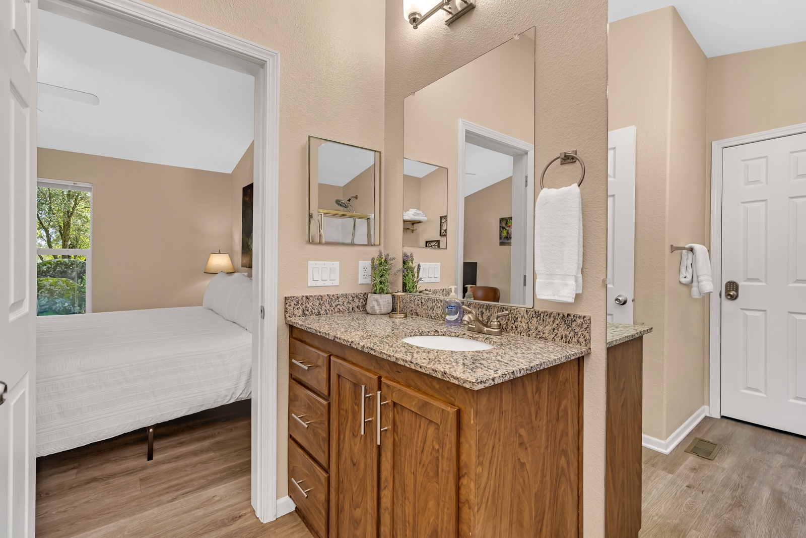 Your private en-suite bathroom is spacious and has ample storage.