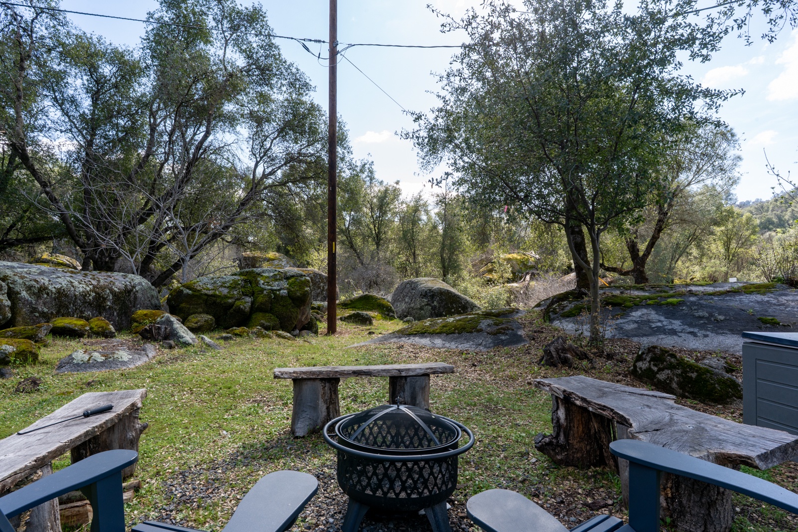 Outdoor seating area with fire pit creates a peaceful wilderness retreat. Firepit available Nov1st-Apr30th