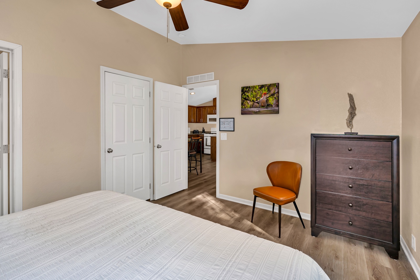 Your primary bedroom conveniently leads to the main living area and easy access to your full kitchen.