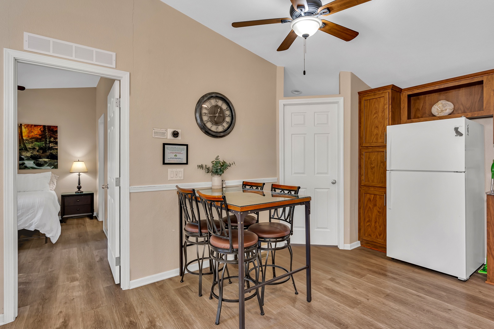 Enjoy meals on the quaint bar height dining table that seats four.