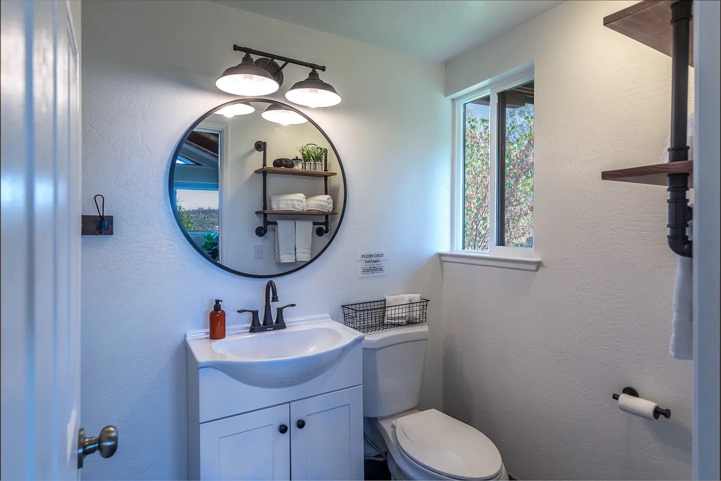 Fully stocked bathroom with shower.