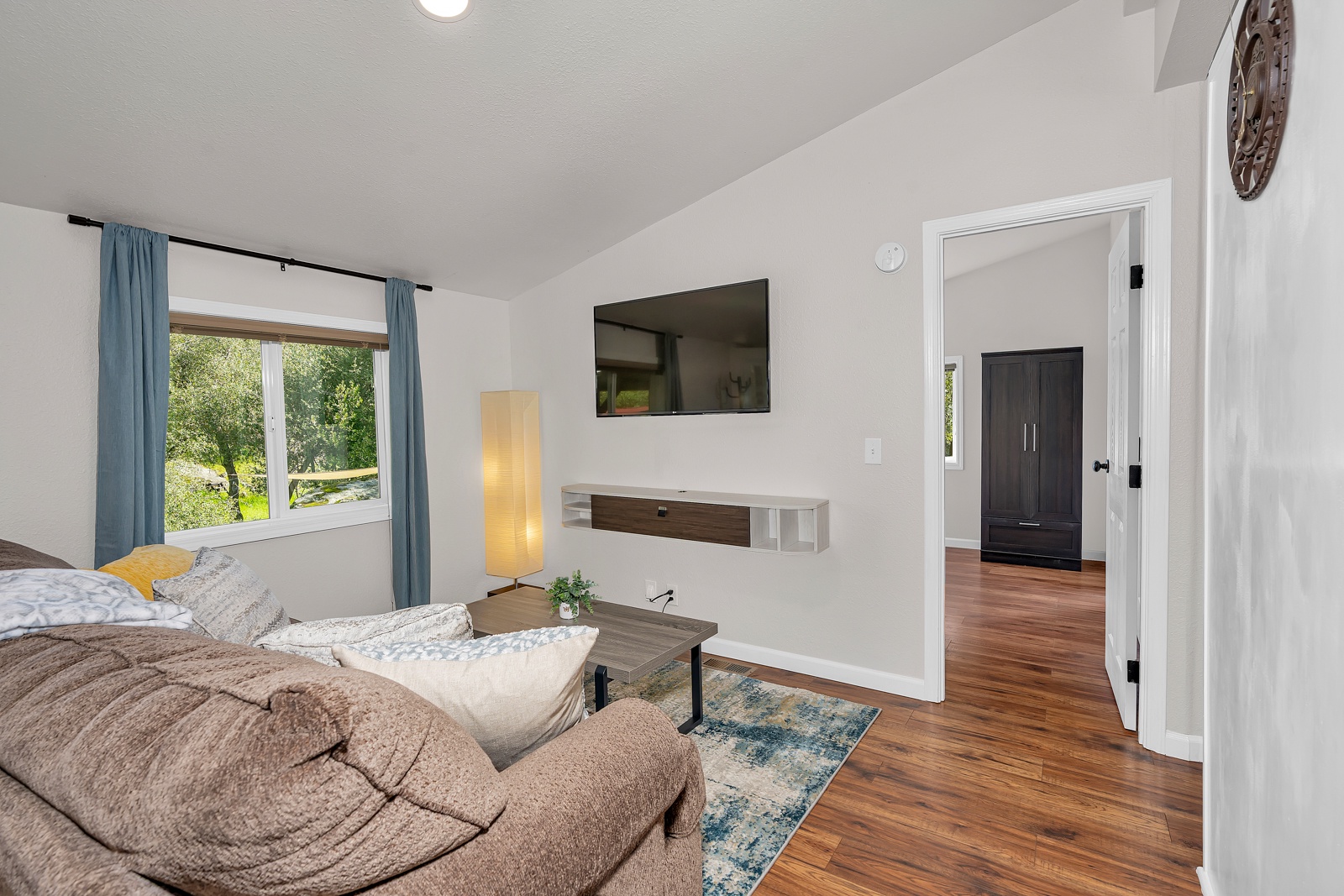 Enjoy your peaceful living room with views, cozy seating, and modern amenities for the perfect retreat.