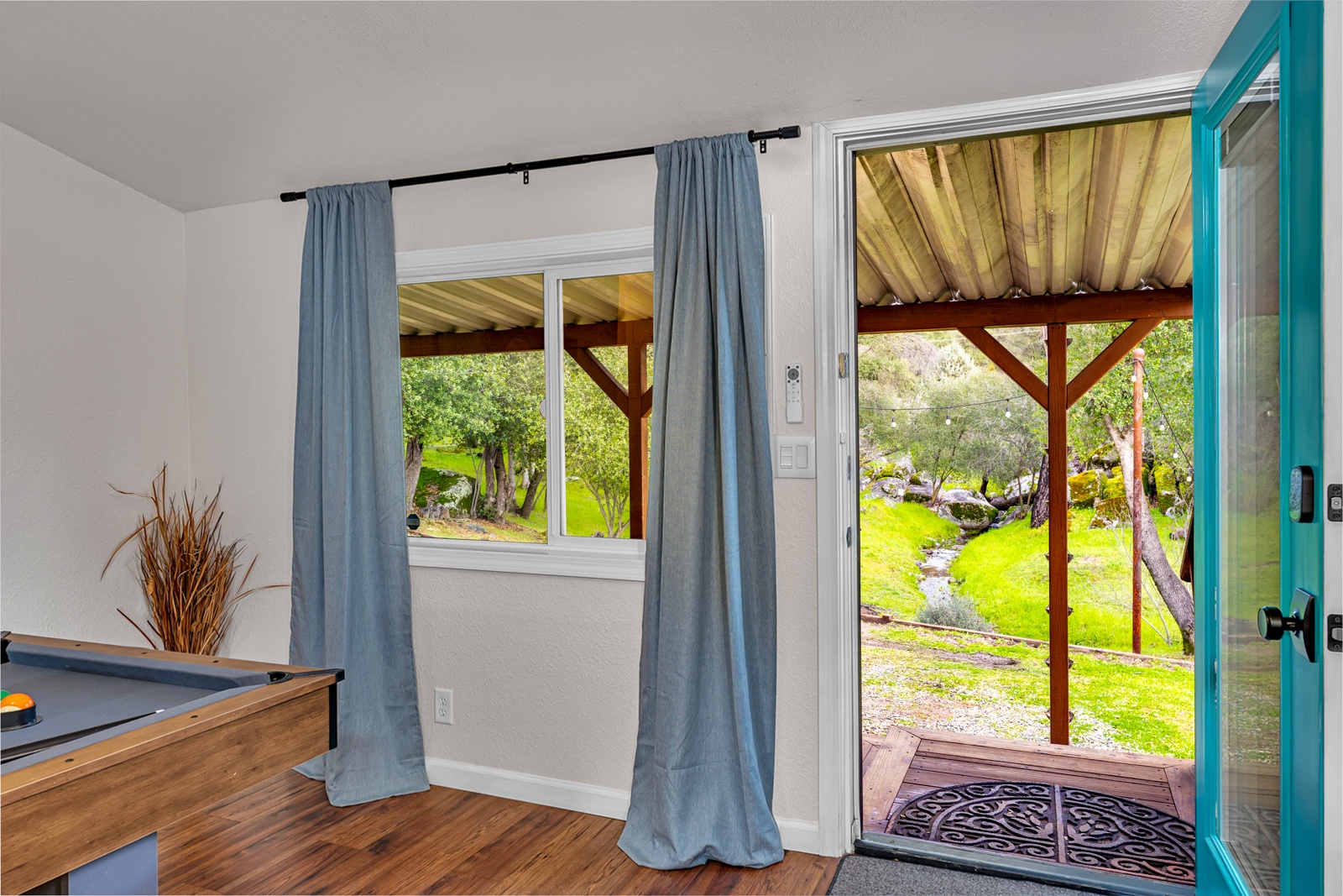 Step in from your covered patio overlooking the seasonal creek—your perfect spot to unwind.