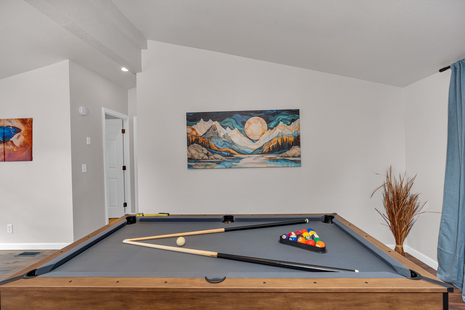 Challenge friends to pool while admiring mountain artwork in your retreat.