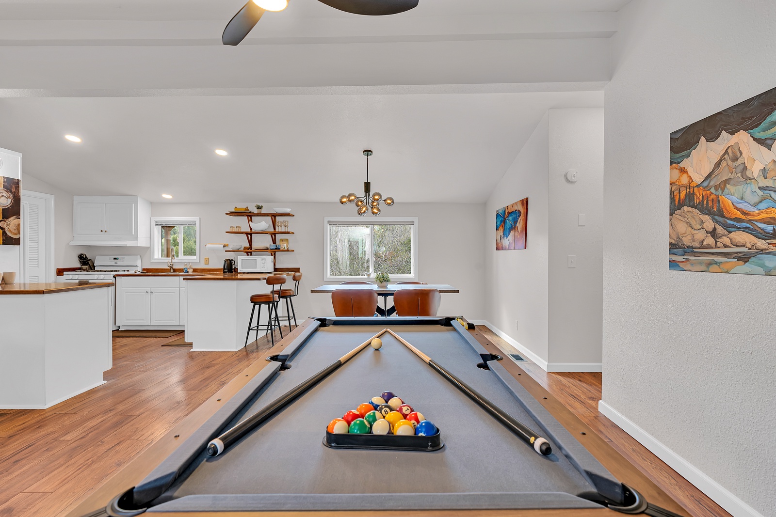 Challenge friends to pool while your chef preps dinner in this open-concept space retreat.