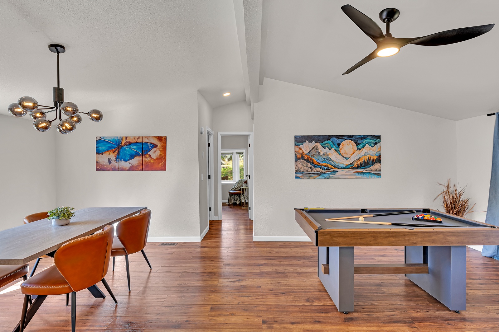 Your entertainment awaits with a stylish pool table and elegant dining space, perfect for memorable evenings with friends and family.